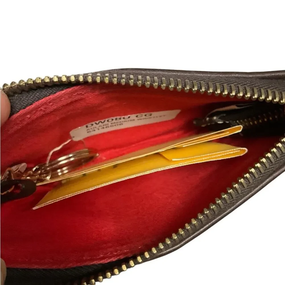 Dooney & Bourke Embossed Disney Aulani Wristlet NEW